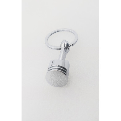 Llavero metálico Pistón