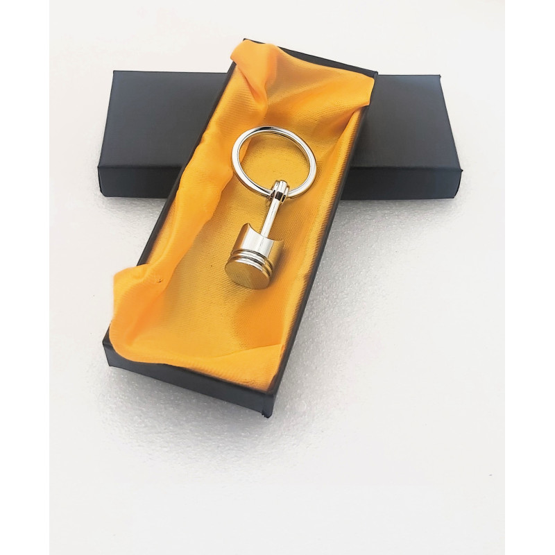 Llavero metálico Pistón