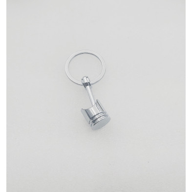 Llavero metálico Pistón