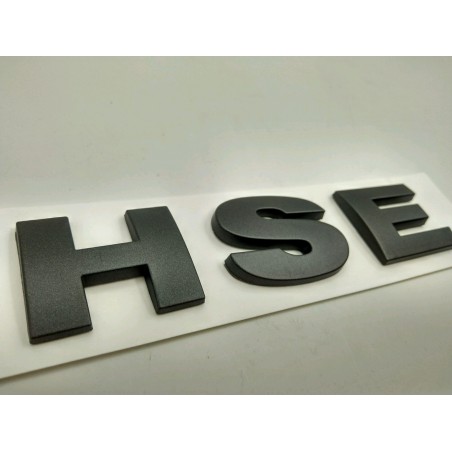 EMBLEMA TRASERO HSE LAND ROVER GRIS OSCURO